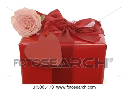 Stock Image - Red gift with a pink rose. Fotosearch