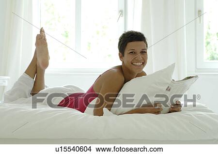 Picture - Relaxing on the couch. Fotosearch