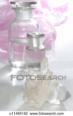 Rock crystal and small bottles View Large Photo Image Stock Image - Rock crystal and small bottles. Fotosearch