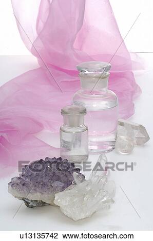 Rock crystal and small bottles View Large Photo Image Stock Image - Rock crystal and small bottles. Fotosearch