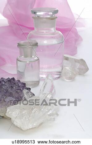 Stock Image - Rock crystal and small bottles. Fotosearch