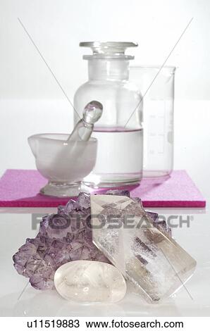 Rock crystal, motar and small bottles View Large Photo Image Stock Image - Rock crystal, motar and small bottles. Fotosearch