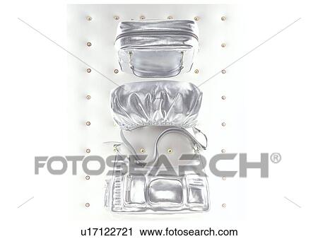 Stock Image - Silver handbags. Fotosearch