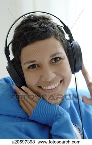 Stock Photo - Smiling woman with headset. Fotosearch