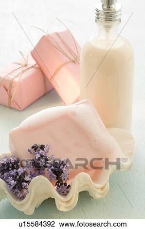 Stock Image - Soap in a mussel soap dish with lavender blossom. Fotosearch