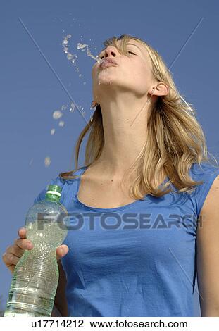 Stock Image - Spitting water. Fotosearch