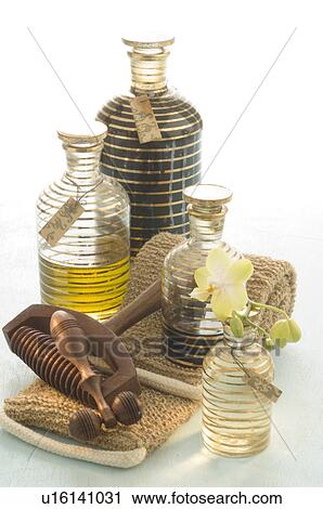Stock Image - Stilllife with massage roller, strap and cosmetic bottles. Fotosearch
