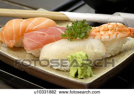 Stock Image - Sushi and chopsticks. Fotosearch