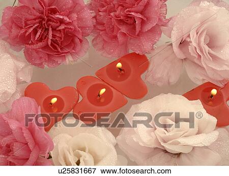 Swimming candles and blossoms in a bowl View Large Photo Image Stock Photo - Swimming candles and blossoms in a bowl. Fotosearch