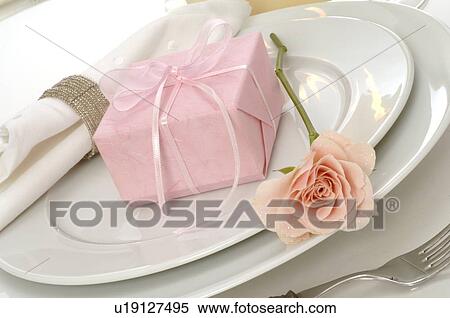 Table decoration with pink rose and present View Large Photo Image Stock Photography - Table decoration with pink rose and present. Fotosearch