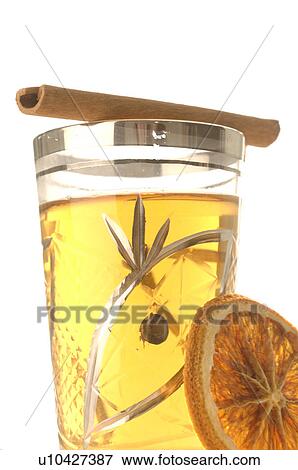 Stock Photo - Tea glass with cinnamon stick and orange slice. Fotosearch