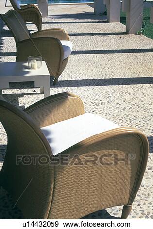 Stock Photo - terrace with wicker chair. Fotosearch
