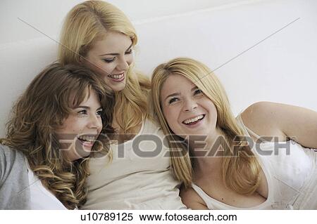 Stock Photography - Three girl friends. Fotosearch