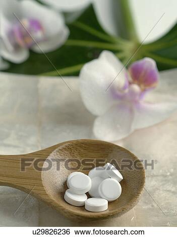 Tissue salts in wooden spoon View Large Photo Image Stock Photograph - Tissue salts in wooden spoon. Fotosearch