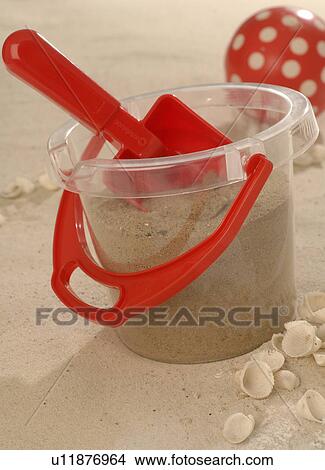 Toy bucket and shovel in the sand View Large Photo Image Picture - Toy bucket and shovel in the sand. Fotosearch