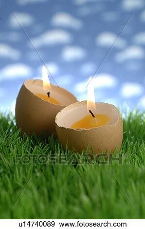 Stock Photo - Two candles in egg form. Fotosearch