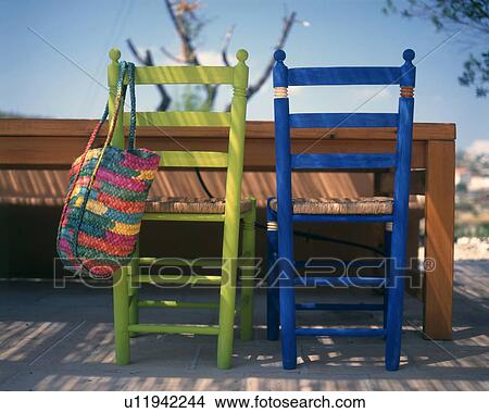 Picture - two chairs blau and green. Fotosearch