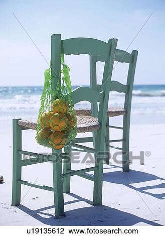 Stock Image - two chairs on the beach. Fotosearch