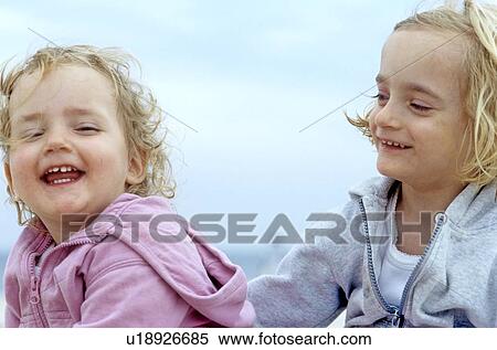 Stock Photography - Two girl todlers at the seaside. Fotosearch