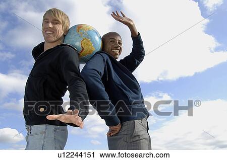 Two men with globe View Large Photo Image Stock Image - Two men with globe. Fotosearch
