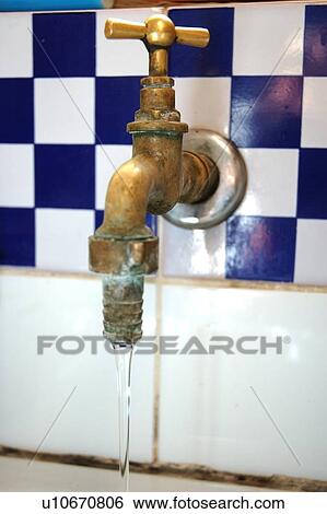 Stock Photograph - Water running from faucet. Fotosearch