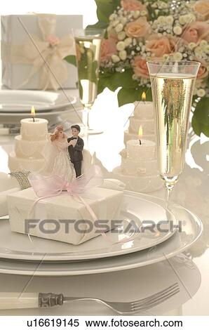 Wedding desk with bridal couple and a gift View Large Photo Image Stock Photography - Wedding desk with bridal couple and a gift. Fotosearch