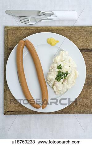 Wieners with potato salad and mustard View Large Photo Image Stock Image - Wieners with potato salad and mustard. Fotosearch
