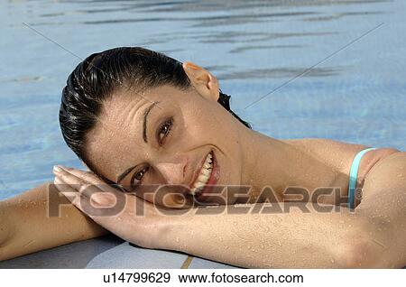 Woman at pool edge View Large Photo Image Stock Photo - Woman at pool edge. Fotosearch