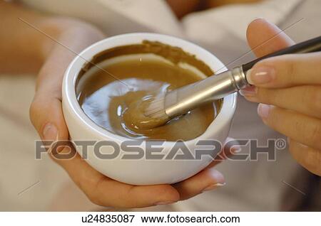 Woman compounding healing earth for a facial mask View Large Photo Image Stock Photo - Woman compounding healing earth for a facial mask. Fotosearch