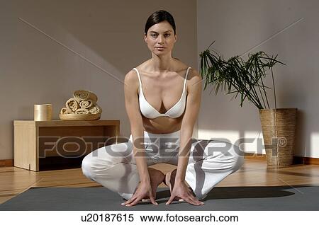 Stock Photography - Woman doing yoga exercise. Fotosearch