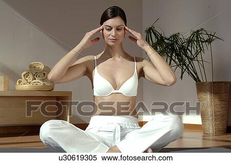 Woman doing yoga exercise View Large Photo Image Stock Photography - Woman doing yoga exercise. Fotosearch