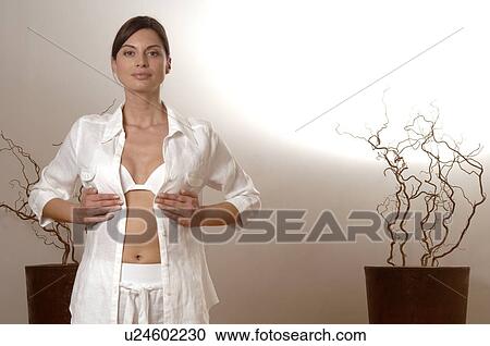 Stock Image - Woman doing yoga exercises. Fotosearch