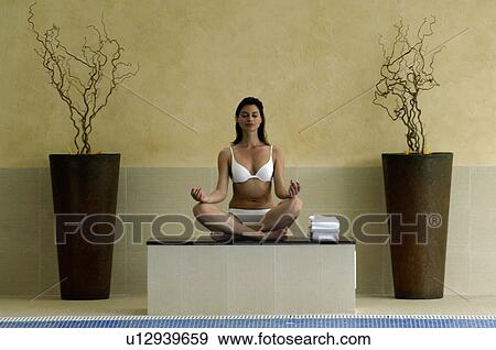 Woman doing yoga exercises View Large Photo Image Stock Photo - Woman doing yoga exercises. Fotosearch