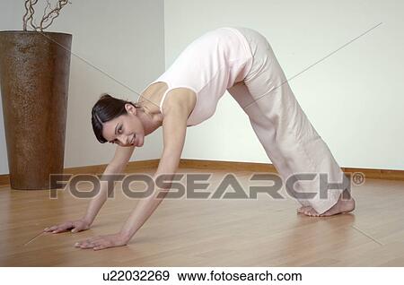Woman doing yoga exercises View Large Photo Image Stock Photo - Woman doing yoga exercises. Fotosearch