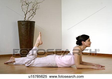 Woman doing yoga exercises View Large Photo Image Stock Photography - Woman doing yoga exercises. Fotosearch