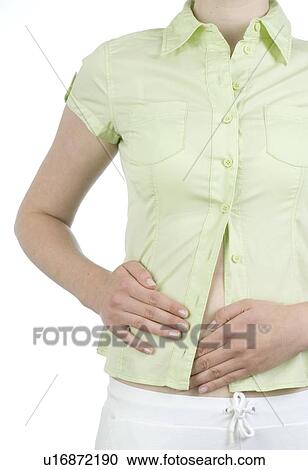 Stock Image - Woman having stomach aches. Fotosearch