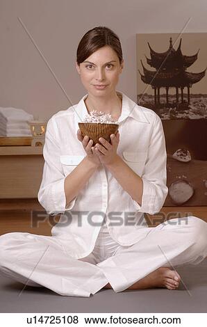 Woman holding a bowl filled with blossoms View Large Photo Image Stock Photo - Woman holding a bowl filled with blossoms. Fotosearch