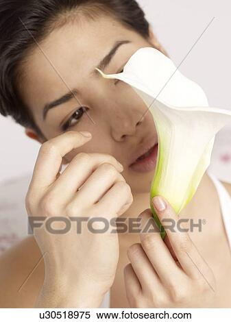 Woman holding calla View Large Photo Image Stock Photography - Woman holding calla. Fotosearch