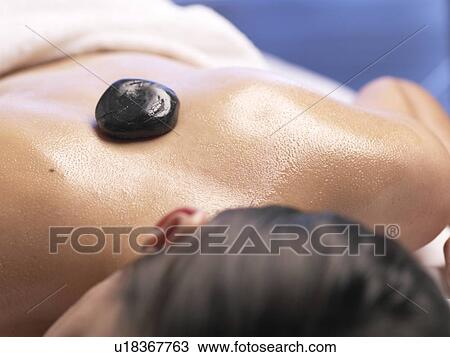 Woman, Hot Stone Massage View Large Photo Image Stock Image - Woman, Hot Stone Massage. Fotosearch