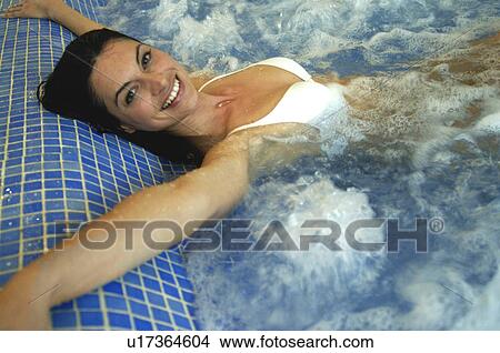 Woman in a whirlpool View Large Photo Image Picture - Woman in a whirlpool. Fotosearch
