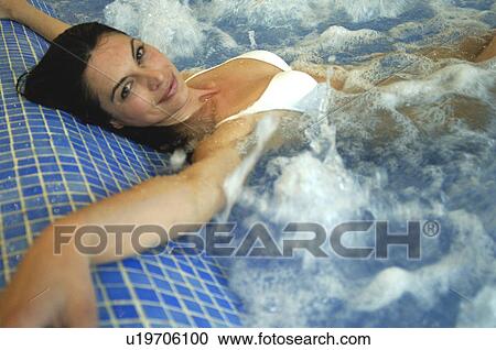Stock Image - Woman in a whirlpool. Fotosearch