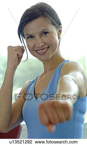 Woman in sportswear doing aerobic exercises View Large Photo Image Stock Image - Woman in sportswear doing aerobic exercises. Fotosearch