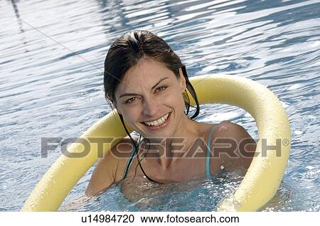 Woman in swimming pool with water aerobic device View Large Photo Image Stock Image - Woman in swimming pool with water aerobic device. Fotosearch