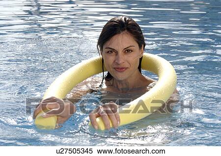 Woman in swimming pool with water aerobic device View Large Photo Image Stock Photography - Woman in swimming pool with water aerobic device. Fotosearch