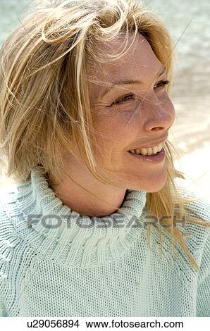 Woman in turquoise pullover at the sea View Large Photo Image Picture - Woman in turquoise pullover at the sea. Fotosearch