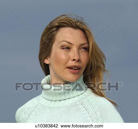 Woman in turquoise pullover at the sea View Large Photo Image Stock Image - Woman in turquoise pullover at the sea. Fotosearch
