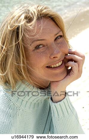 Woman in turquoise pullover at the sea View Large Photo Image Stock Photo - Woman in turquoise pullover at the sea. Fotosearch