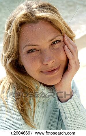 Woman in turquoise pullover at the sea View Large Photo Image Stock Photo - Woman in turquoise pullover at the sea. Fotosearch