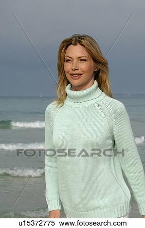 Woman in turquoise pullover at the sea View Large Photo Image Stock Photography - Woman in turquoise pullover at the sea. Fotosearch