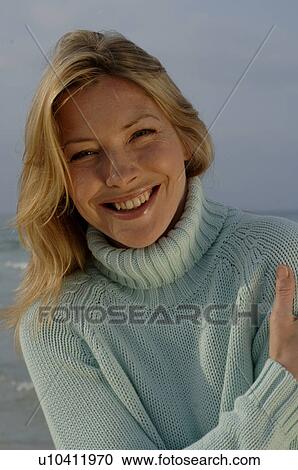 Woman in turquoise sweater at the sea View Large Photo Image Stock Image - Woman in turquoise sweater at the sea. Fotosearch